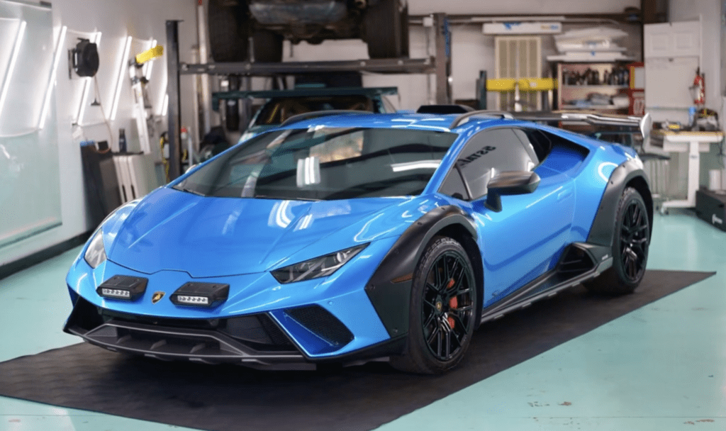 exotic supercar protected by a metallic light blue paint protection film